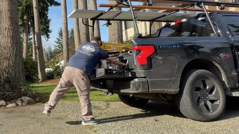 Eastside Garage Door technician inspecting opener and hardware