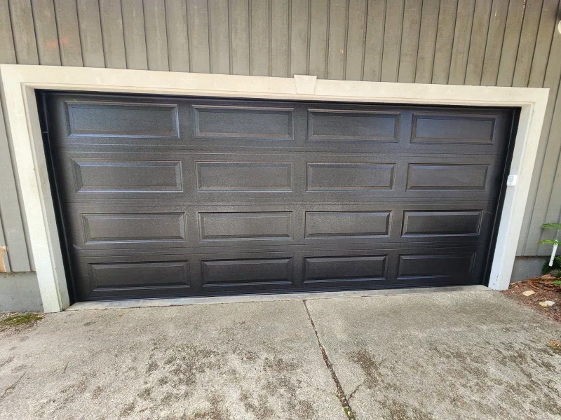 New dark carriage-style garage door