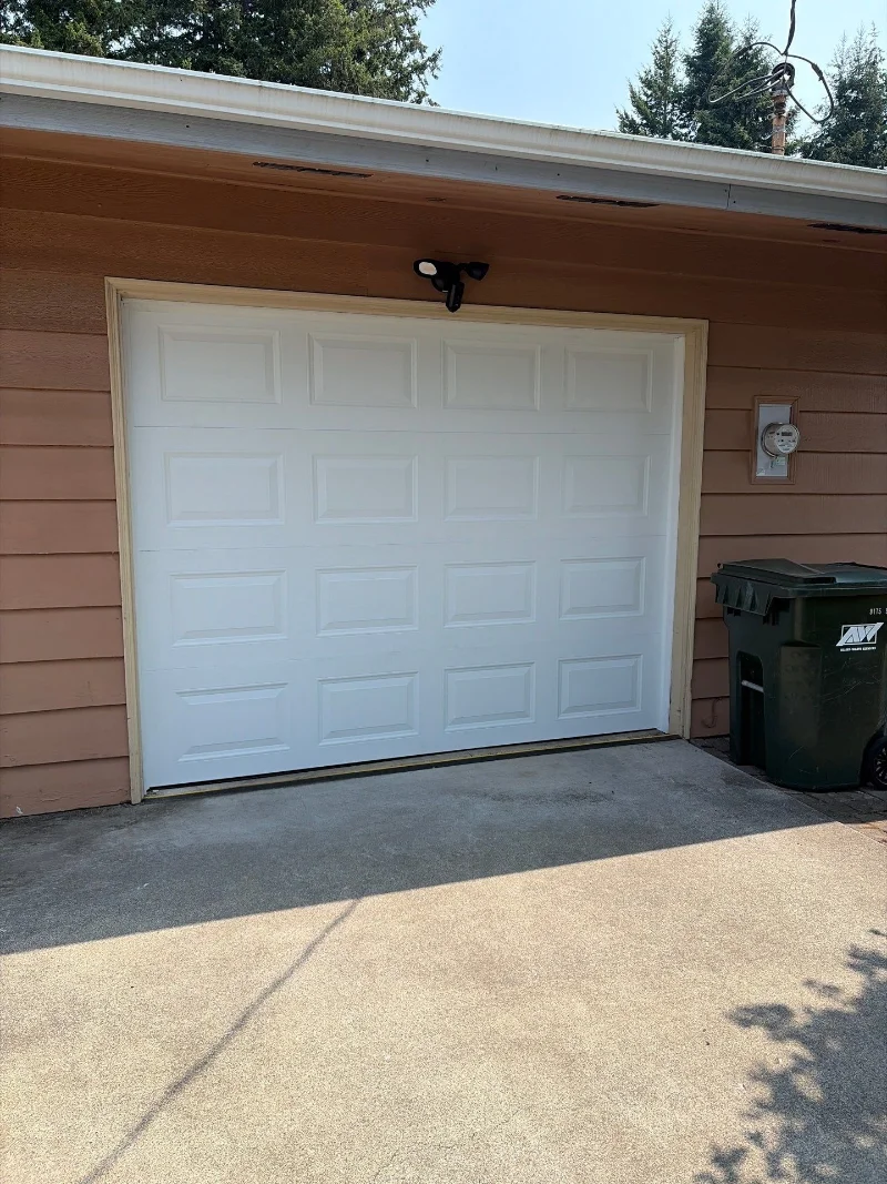 New white raised-panel garage door