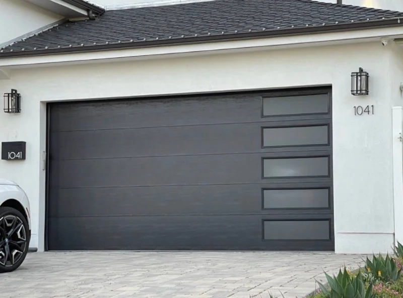 New dark modern garage door with a column of side windows